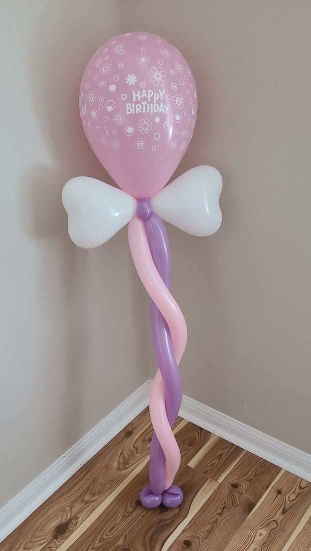 Custom birthday balloon bouquet with bow accent