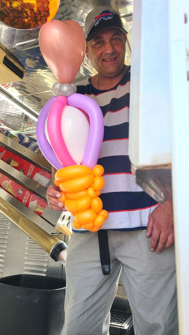 Detailed balloon sculpture held by a guest