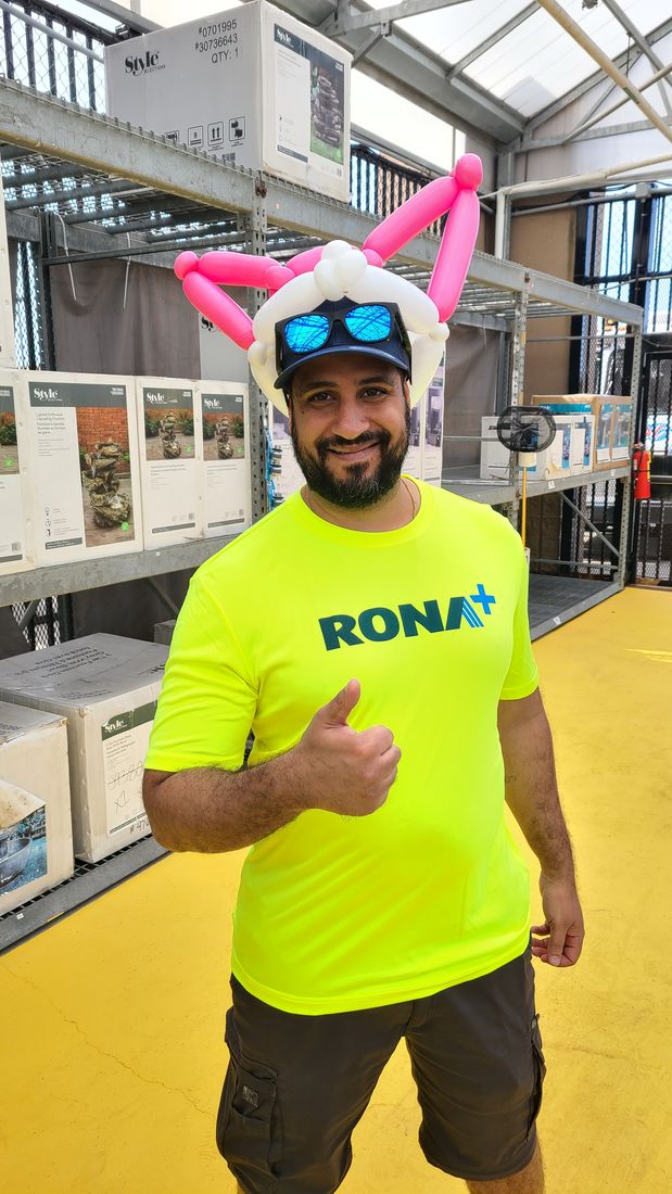 Guest wearing a custom balloon hat at a store event